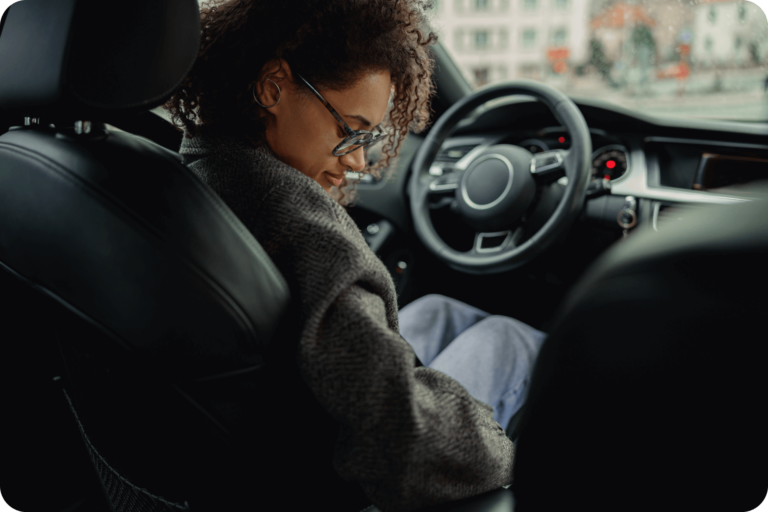 young-woman-driver-in-eyeglasses-fastens-her-seat-2023-03-17-23-21-09-utc 1 (1)